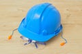 A hard hat, safety glasses and a pair of ear plugs Royalty Free Stock Photo