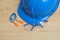 A hard hat, safety glasses and a pair of ear plugs Royalty Free Stock Photo