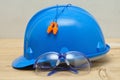 A hard hat, safety glasses and a pair of ear plugs Royalty Free Stock Photo