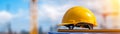 Hard hat on stack of papers construction project management and safety construction Royalty Free Stock Photo