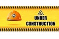 Hard Hat on Under Construction Board Royalty Free Stock Photo