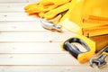 Hard hat and various tools on wooden background Royalty Free Stock Photo