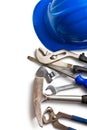 Hard hat with various working tools Royalty Free Stock Photo