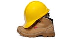Hard Hat and Work Boots Royalty Free Stock Photo