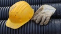Hard hat and work gloves in construction site Royalty Free Stock Photo