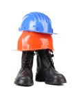 Hard hat and working boots. Royalty Free Stock Photo