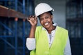 Hard hats over high heels. Portrait of a confident young woman working a construction site. Royalty Free Stock Photo