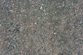 Hard road surface consisting of many stones mixed with asphalt