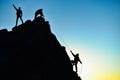 hard rock climbing and achievements of people struggling together Royalty Free Stock Photo