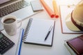 Hard safety hat and notepad on project working desk. Royalty Free Stock Photo