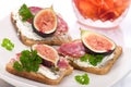 Hard salami with figs canapes Royalty Free Stock Photo