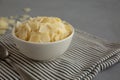 Hard Shaved Parmesan Cheese in a Bowl, side view. Close-up Royalty Free Stock Photo