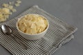 Hard Shaved Parmesan Cheese in a Bowl, side view. Copy space Royalty Free Stock Photo