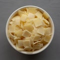 Hard Shaved Parmesan Cheese in a Bowl, top view Royalty Free Stock Photo