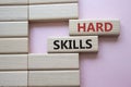 Hard skills symbol. Wooden blocks with words Hard skills. Beautiful pink background. Business and Hard skills concept. Copy space