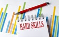 HARD SKILLS text on a notebook with chart and pen business concept