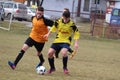 Hard tackle in soccer preseason game Royalty Free Stock Photo