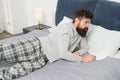 Hard to wake up. bearded man hipster want to sleep in morning. brutal sleepy man in bedroom. mature male with beard in