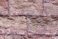 Hard uneven and weathered light brown block marble rough background Royalty Free Stock Photo