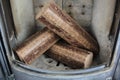 Hard wood briquettes in stove Royalty Free Stock Photo