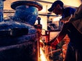 A hard worker mixing machine repair grinder showers sparks while working with metal