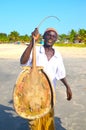 Hard working fisher man bringing stingfish Royalty Free Stock Photo