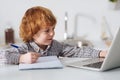 Hard working smart boy studying for his test Royalty Free Stock Photo