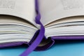 A hardback book with bookmark lying closed close up, selective focus Royalty Free Stock Photo