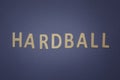 Hardball written with wooden letters on a blue background