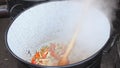 Hardened vegetables in large cauldron