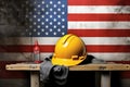 Hardhat and construction tools on a grunge USA flag background Royalty Free Stock Photo