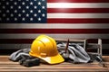 Hardhat and construction tools on USA flag background. Labor day concept Royalty Free Stock Photo