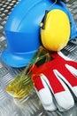 Hardhat, earmuffs, glasses and gloves Royalty Free Stock Photo