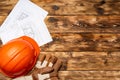 Hardhat, gloves and blueprints of a builder Royalty Free Stock Photo