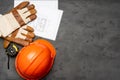 Hardhat, gloves and blueprints of a builder Royalty Free Stock Photo