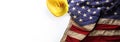 Hardhat on US American flag. Strong American workforce or industry, or America labor day concept. Blank copy space Royalty Free Stock Photo