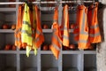 Yellow work vests are hanging on a hanger Royalty Free Stock Photo