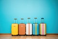 hardshell suitcases in vibrant colors lined up