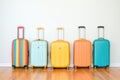 hardshell suitcases in vibrant colors lined up