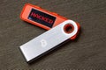 hardware Bitcoin wallet with hacked message on screen Royalty Free Stock Photo