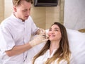 Hardware cosmetology, mesotherapy, Close up of young woman getting treatment of cheek zone at spa Royalty Free Stock Photo