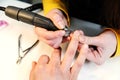 Hardware manicure in a beauty salon.