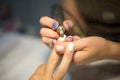 Hardware manicure. Removal of old gel varnish in the salon. Manicure master doing beauty procedure for client, closeup and top vie Royalty Free Stock Photo