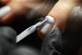 Hardware manicure in the salon. Master manicurist makes a manicure to a girl in a beauty salon. Royalty Free Stock Photo