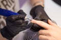 Hardware Manicure using electric device machine. procedure for the preparation of nails before applying nail polish. Hands of Royalty Free Stock Photo