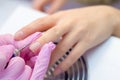 Hardware Manicure using electric device machine. procedure for the preparation of nails before applying nail polish. Hands of