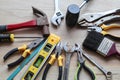 Hardware and many different tools basic instruments in general mechanic work on wooden background.