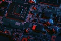 Hardware technology concept in neon light. Motherboard in blue-red light. Computer component. Dark photo.Neon Colors.GPU