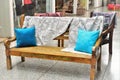 Hardwood benches with blue cushions and fabrics
