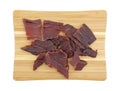 Hardwood smoked beef jerky on a cutting board Royalty Free Stock Photo